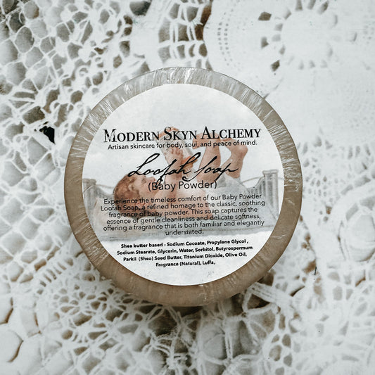 Container of Modern Skin Alchemy baby powder on a textured white background